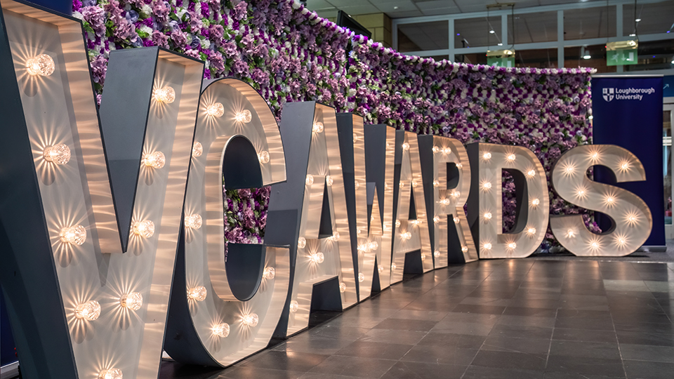 An image of big white letters spelling out 'VC Awards'